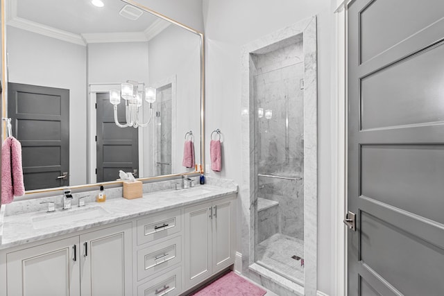 bathroom with ornamental molding, a sink, a marble finish shower, and double vanity