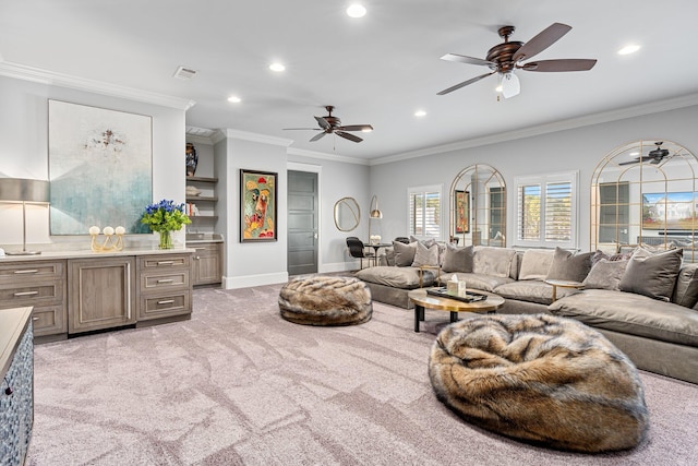 living area with light carpet, baseboards, ceiling fan, ornamental molding, and recessed lighting