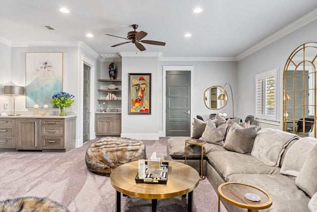 carpeted living room featuring baseboards, ornamental molding, a ceiling fan, and recessed lighting