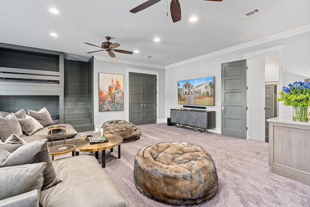 living room featuring carpet floors, visible vents, and crown molding