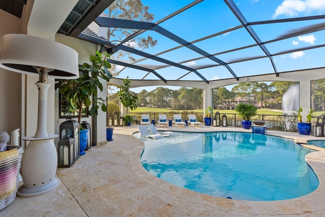 pool featuring a lanai and a patio