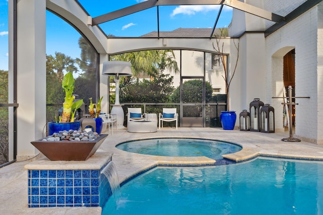 outdoor pool with a lanai, a patio, and an in ground hot tub