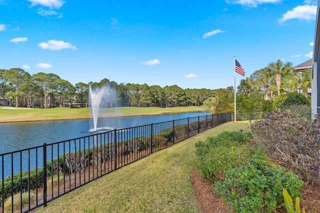 property view of water featuring fence