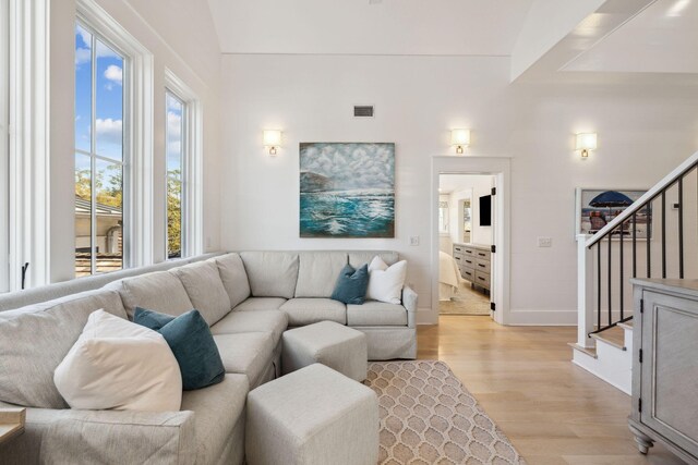 254 E Yacht Pond Ln, Watersound, FL 32461 - living area featuring light wood finished floors, baseboards, visible vents, and stairway