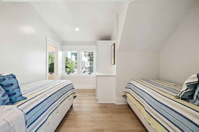 254 E Yacht Pond Ln, Watersound, FL 32461 - bedroom featuring baseboards, vaulted ceiling, light wood-style floors, and recessed lighting