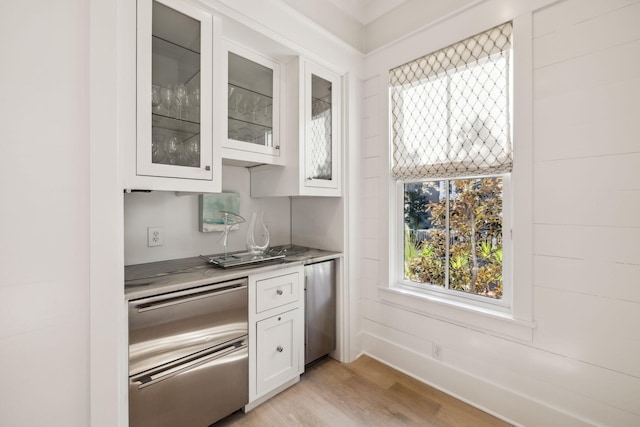 254 E Yacht Pond Ln, Watersound, FL 32461 - kitchen featuring white cabinetry, refrigerator, stainless steel refrigerator, light wood-style flooring, and glass insert cabinets