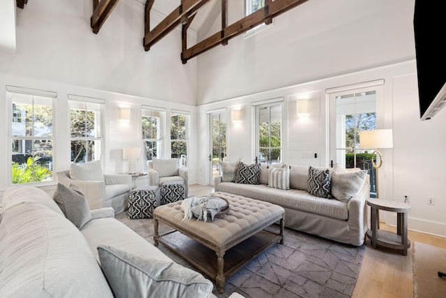 254 E Yacht Pond Ln, Watersound, FL 32461 - living room with baseboards, high vaulted ceiling, wood finished floors, and beam ceiling