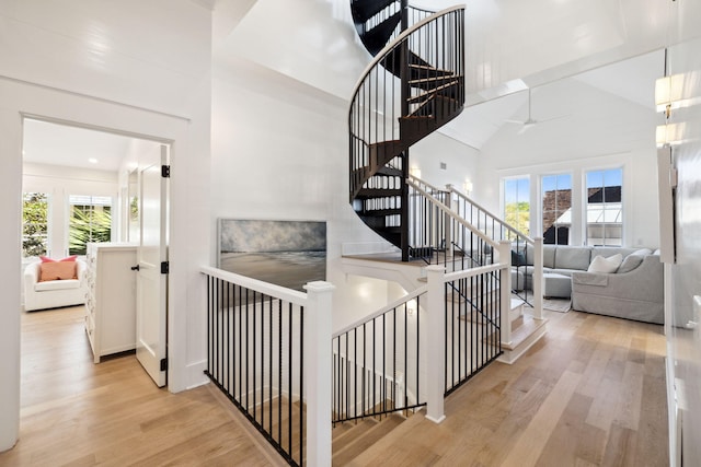 254 E Yacht Pond Ln, Watersound, FL 32461 - stairs with a wealth of natural light, a high ceiling, and wood finished floors