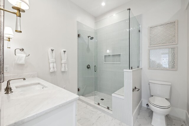 254 E Yacht Pond Ln, Watersound, FL 32461 - bathroom featuring baseboards, marble finish floor, toilet, vanity, and a stall shower