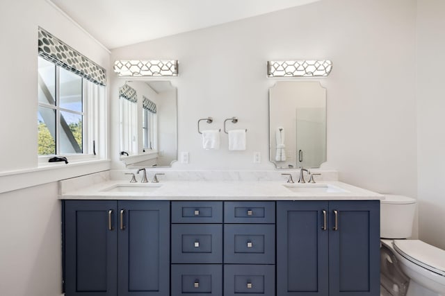 254 E Yacht Pond Ln, Watersound, FL 32461 - bathroom with toilet, a sink, double vanity, and vaulted ceiling