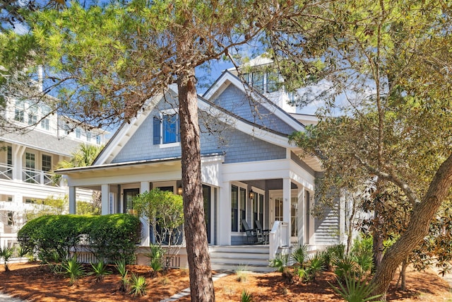 254 E Yacht Pond Ln, Watersound, FL 32461 - view of front of house with a porch