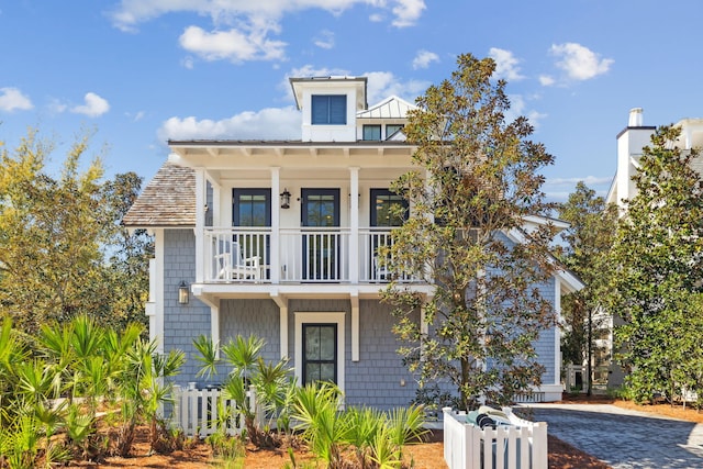 254 E Yacht Pond Ln, Watersound, FL 32461 - view of front of property with a balcony, a porch, and fence