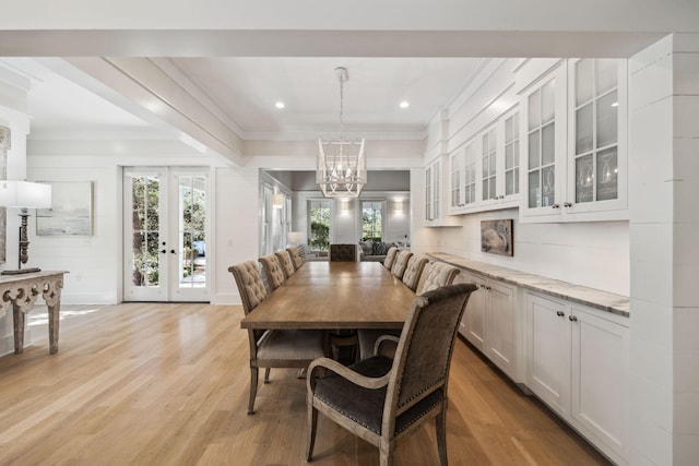 254 E Yacht Pond Ln, Watersound, FL 32461 - dining room with french doors, light wood-style flooring, a notable chandelier, and crown molding