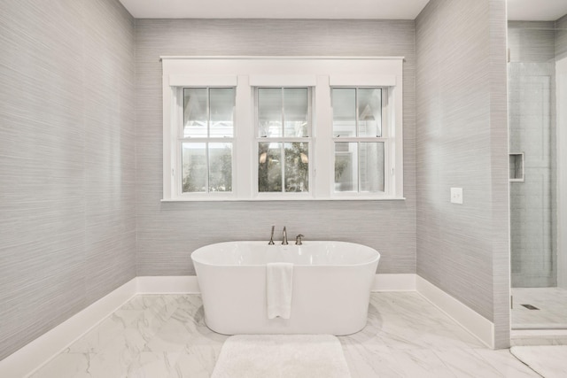254 E Yacht Pond Ln, Watersound, FL 32461 - bathroom with marble finish floor, baseboards, a tile shower, and a freestanding bath