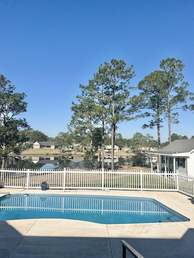 view of swimming pool featuring a fenced in pool and fence