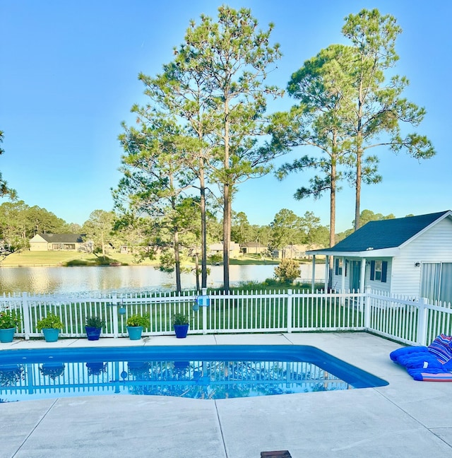 view of pool featuring a patio area, fence, a fenced in pool, and a water view