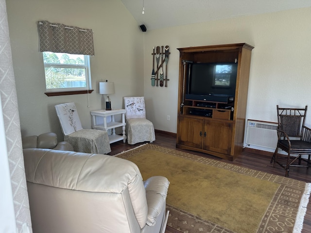 living room with vaulted ceiling and wood finished floors