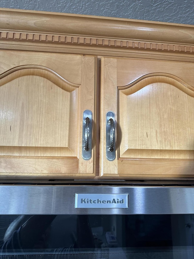 details featuring light brown cabinetry