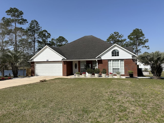 single story home with a front lawn, an attached garage, brick siding, and concrete driveway