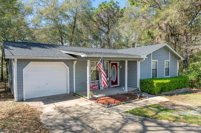 single story home with a shingled roof, covered porch, driveway, and an attached garage