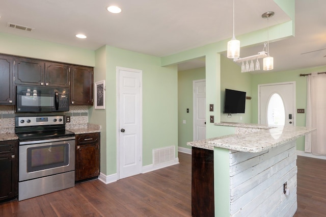 kitchen with electric range, visible vents, black microwave, and dark wood finished floors