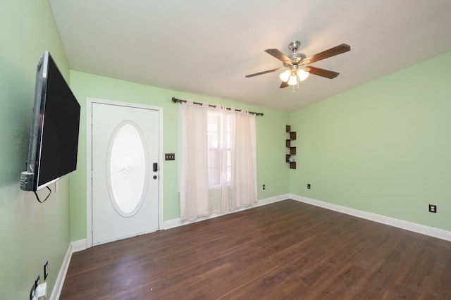 entrance foyer with dark wood-type flooring, baseboards, and a ceiling fan