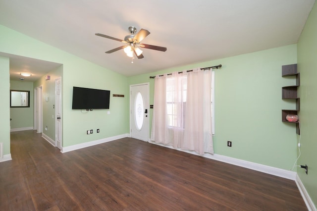 foyer featuring dark wood-type flooring, lofted ceiling, ceiling fan, and baseboards