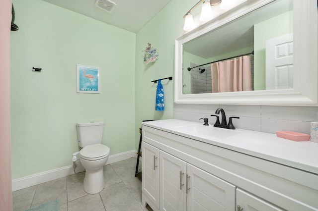 bathroom with visible vents, decorative backsplash, toilet, tile patterned flooring, and vanity