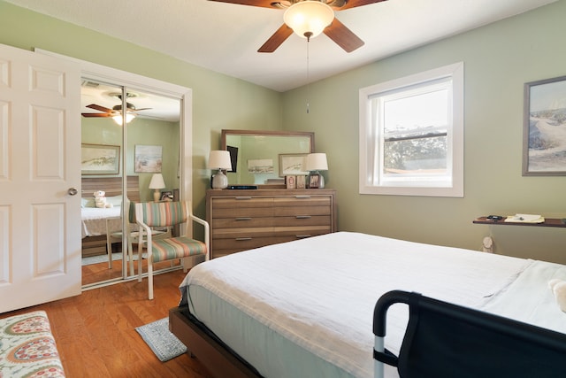 bedroom featuring a closet, a ceiling fan, and wood finished floors