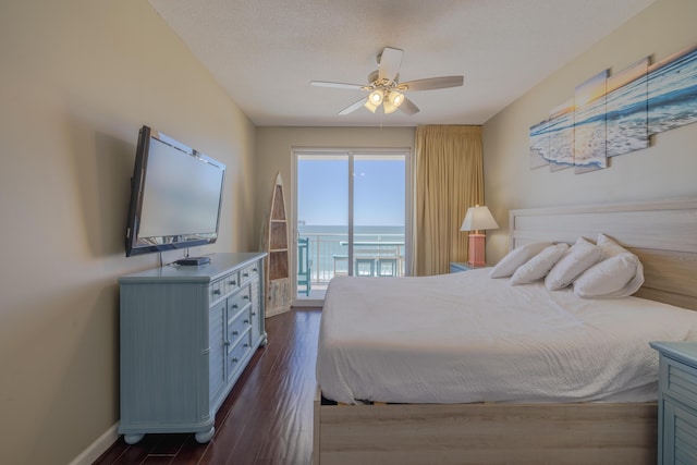 bedroom with access to exterior, ceiling fan, baseboards, and dark wood-type flooring