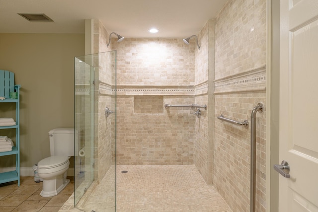 full bath with visible vents, a shower stall, and toilet