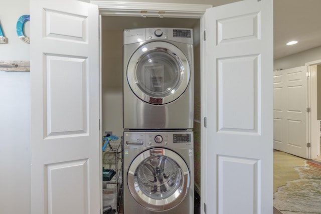 laundry room with laundry area, recessed lighting, and stacked washer / drying machine