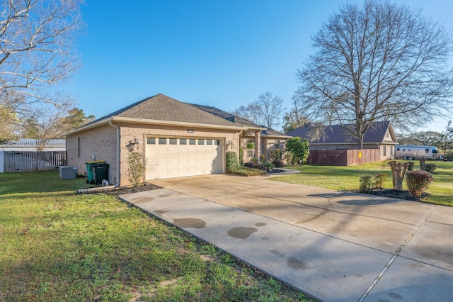 view of home's exterior with a lawn, driveway, fence, a garage, and brick siding