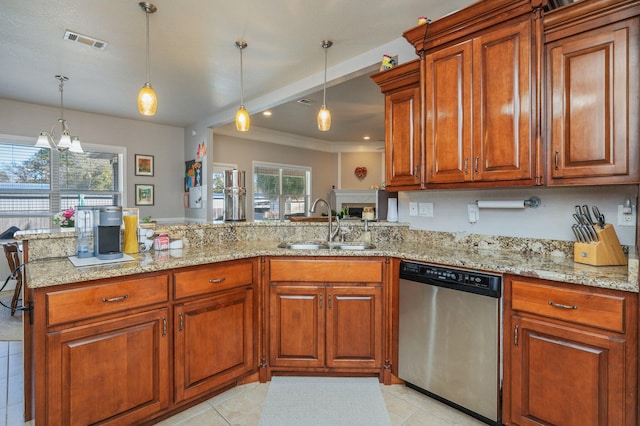 kitchen with visible vents, brown cabinets, dishwasher, and a sink