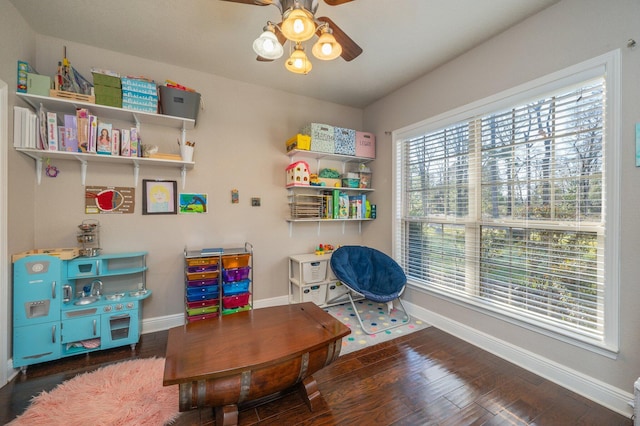 game room featuring ceiling fan, baseboards, and wood finished floors