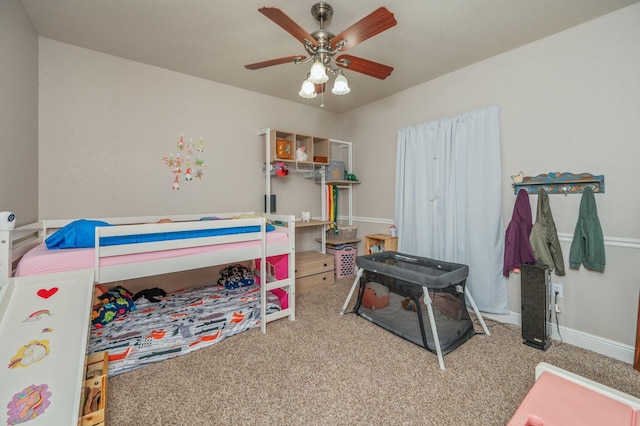 bedroom with baseboards, carpet floors, and ceiling fan