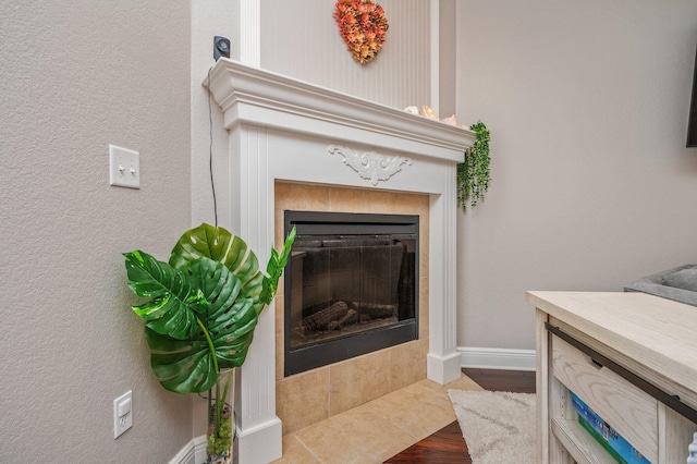 details featuring a fireplace and baseboards