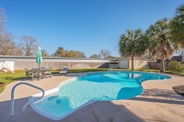 view of swimming pool with a patio area, a fenced in pool, a yard, and a fenced backyard