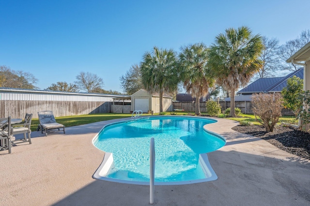 view of pool featuring a fenced in pool, a shed, an outdoor structure, a fenced backyard, and a patio area