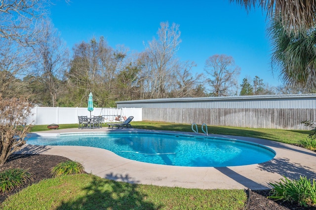 view of pool with a fenced in pool, a patio, a yard, and a fenced backyard