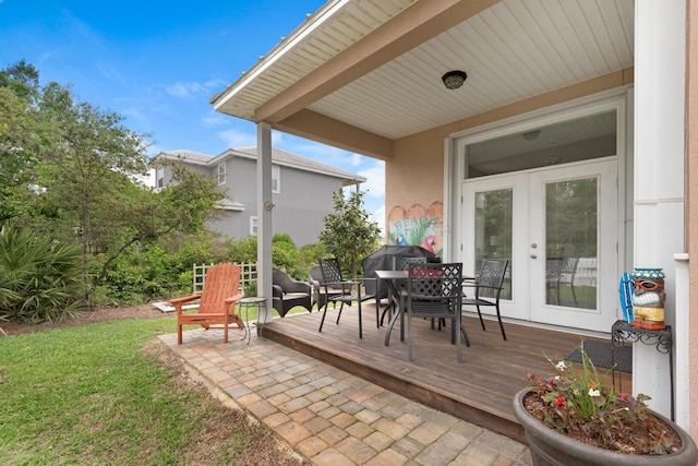 view of patio / terrace with a deck and french doors