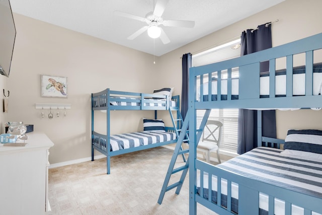 bedroom featuring carpet floors, ceiling fan, and baseboards