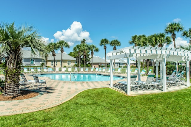 community pool with a patio, fence, a lawn, and a pergola