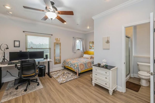 bedroom with light wood-style flooring, ornamental molding, ensuite bath, baseboards, and ceiling fan