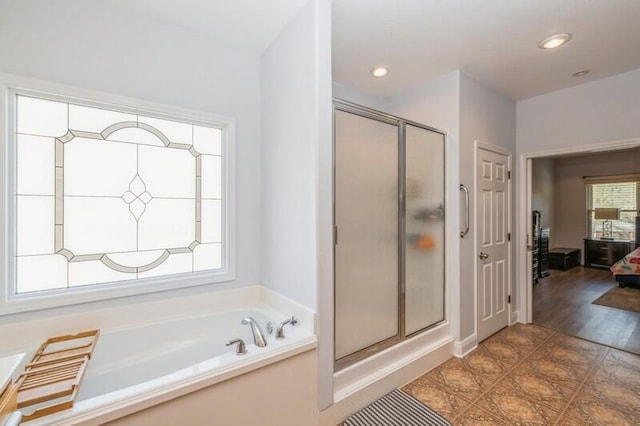 full bath featuring a bath, recessed lighting, a stall shower, and connected bathroom