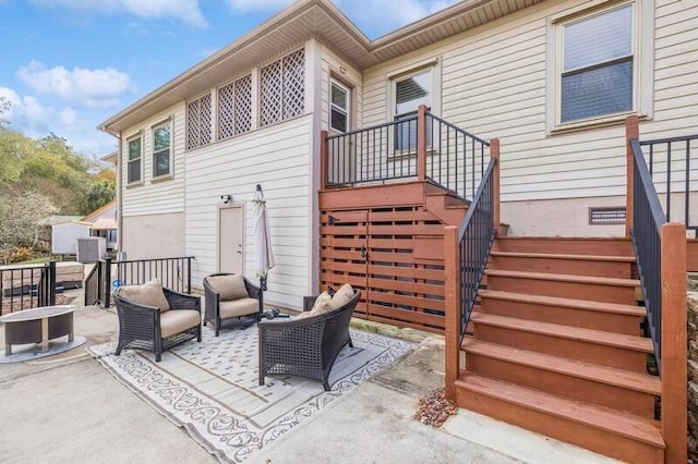 view of patio featuring stairs and an outdoor hangout area