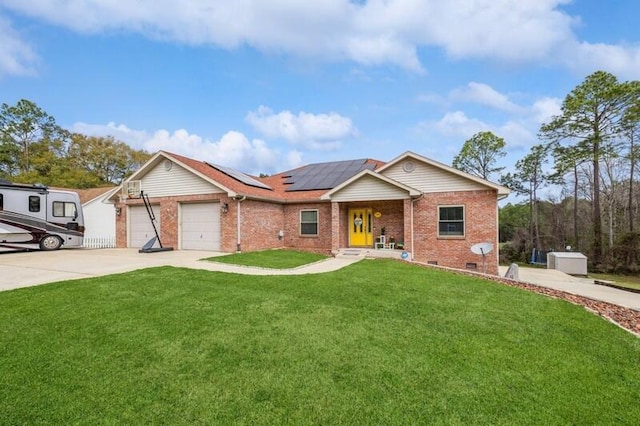 ranch-style home with concrete driveway, a front yard, roof mounted solar panels, a garage, and crawl space