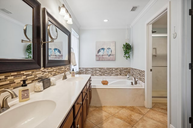 bathroom with a sink, visible vents, and ornamental molding