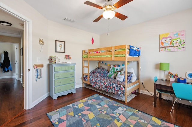 bedroom featuring baseboards and hardwood / wood-style floors