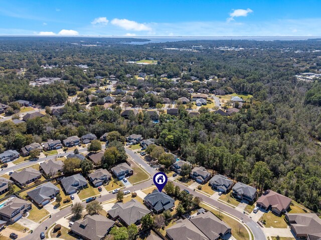 aerial view with a residential view and a view of trees